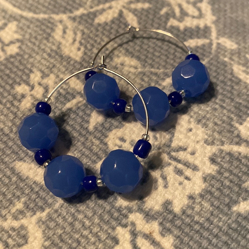 Beaded blue and silver seed bead and glass bead hoop earrings.